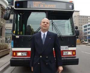 DAVID LEPOFSKY STANDS IN FRONT OF A TTC BUS. 